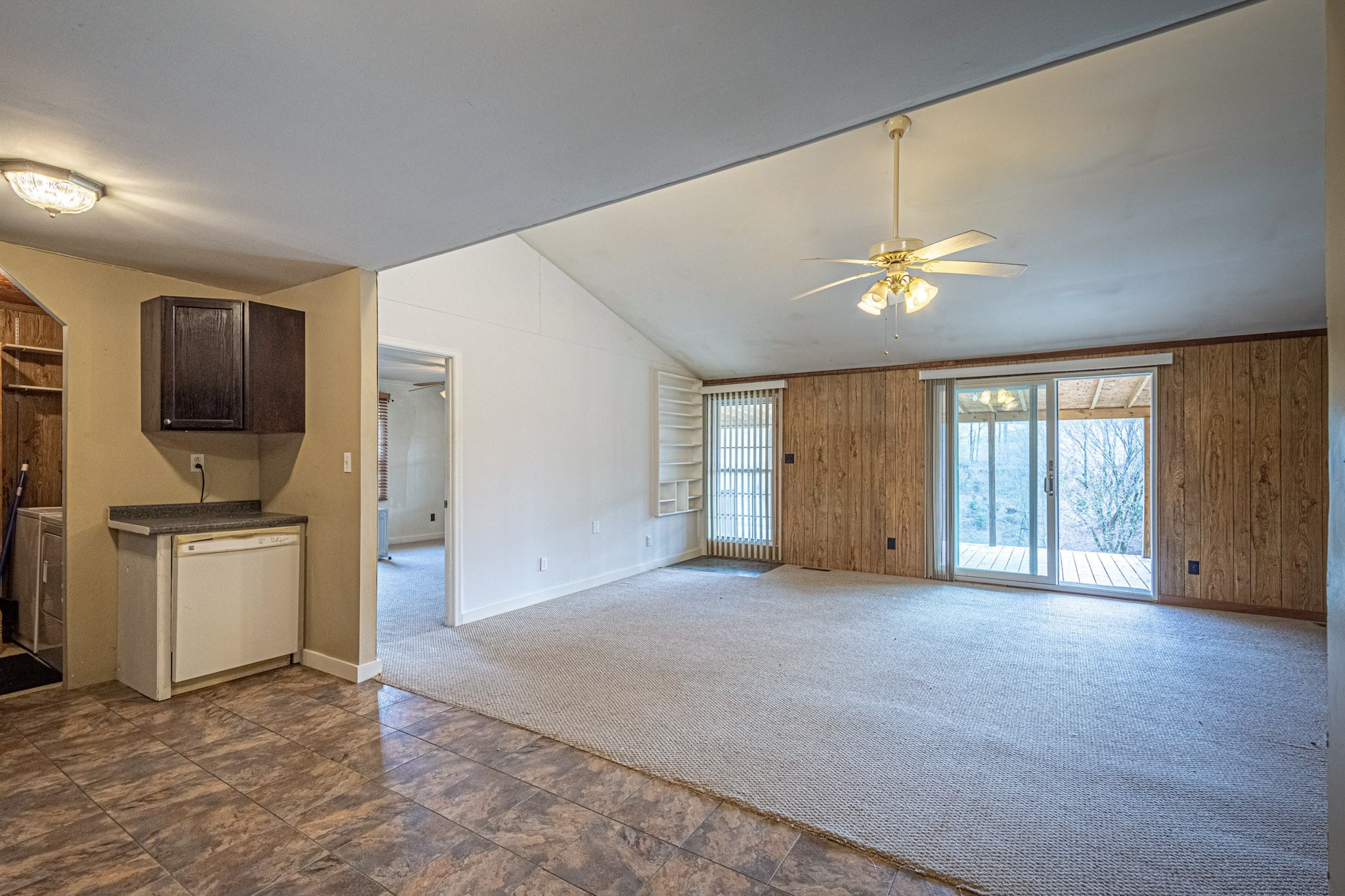 2688 Tackets Branch Road Prospect, TN 38477 - Photo 14 of 41 a view of an empty room with a window and a kitchen