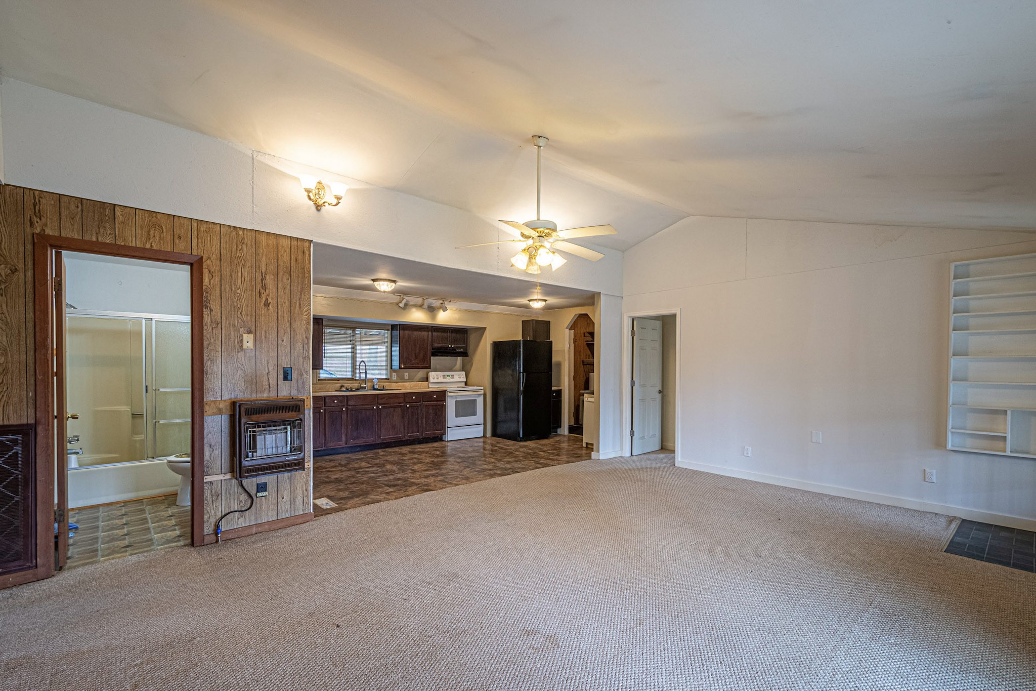 2688 Tackets Branch Road Prospect, TN 38477 - Photo 8 of 41 a view of an empty room with kitchen and a window