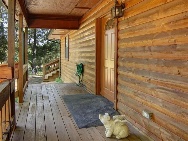 a view of balcony with wooden floor