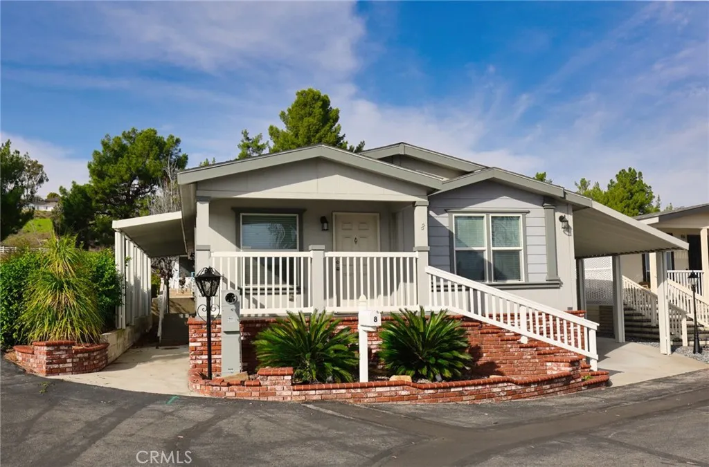 8651 Foothill, Unit 8 Rancho Cucamonga, CA 91730 - Photo 1 of 1 a front view of a house with a yard