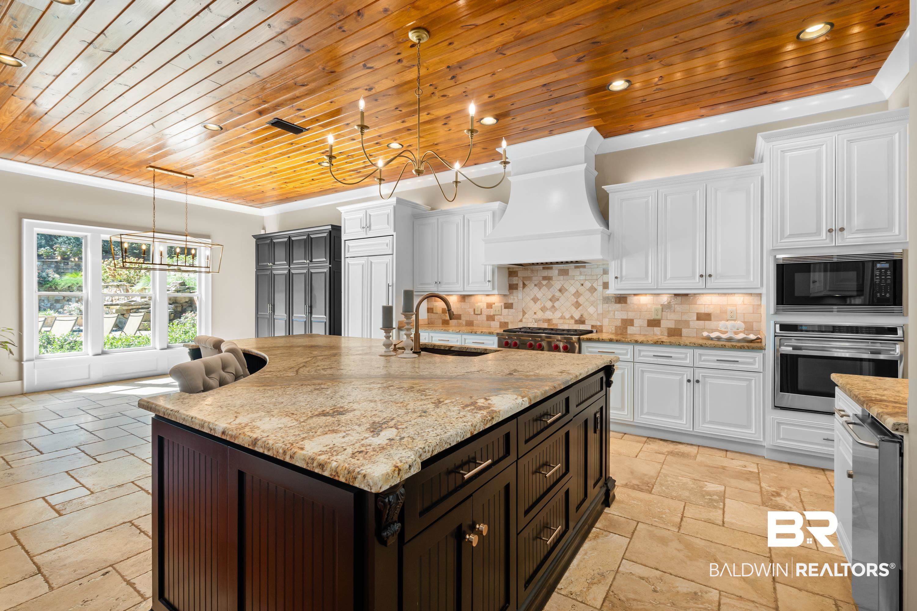 30057 Dolive Ridge Daphne, AL 36527 - Photo 14 of 55 Kitchen with white cabinets, pendant lighting, stainless steel appliances, custom exhaust hood, and sink