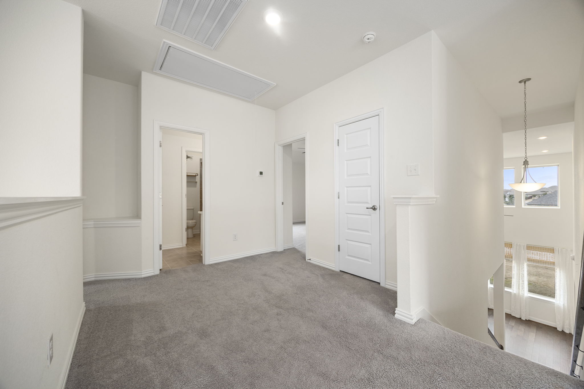 1098 Cherrystone Loop Buda, TX 78610 - Photo 21 of 37 an empty room with windows
