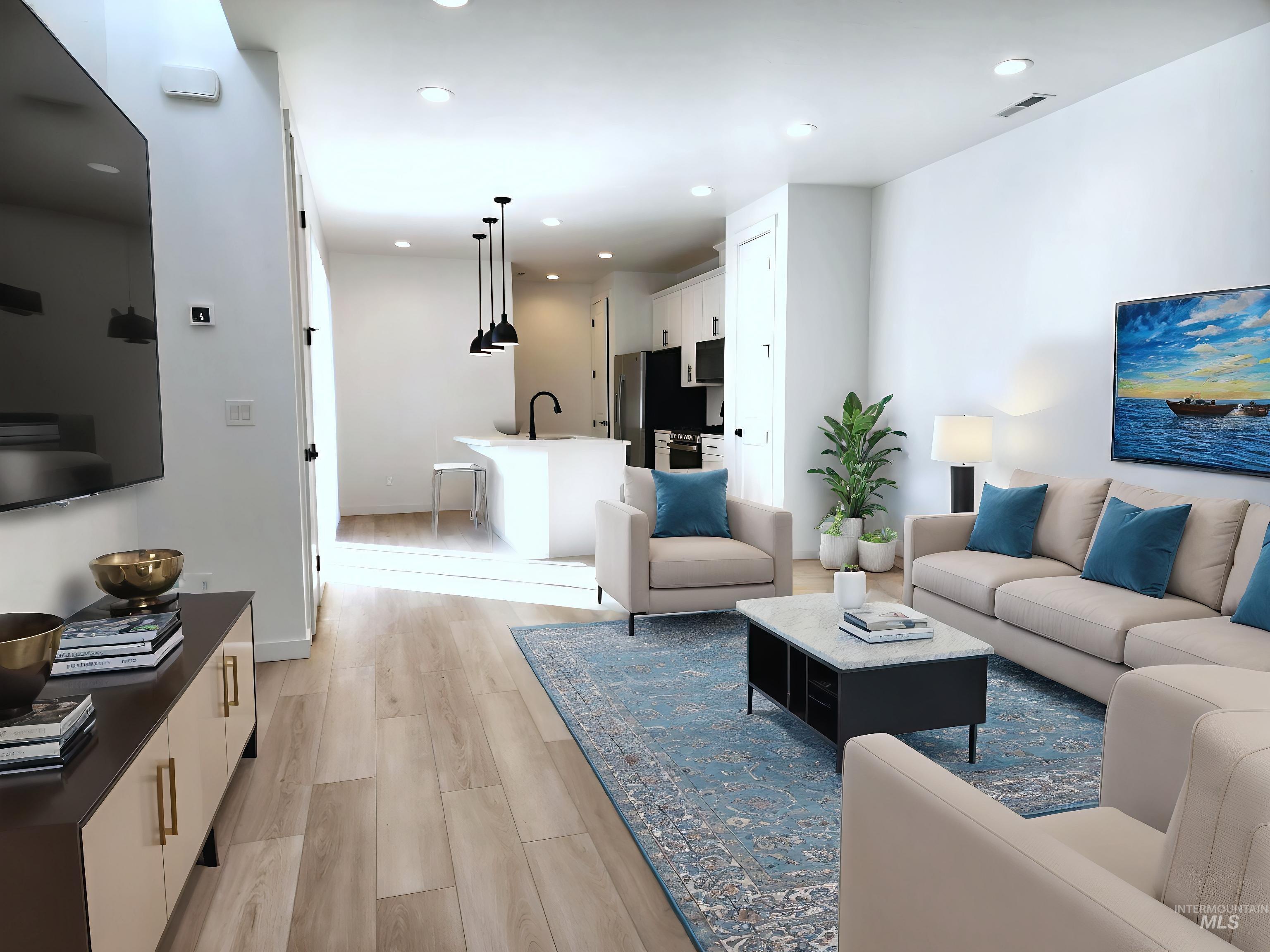 12267 West Endsley Street Star, ID 83669 - Photo 3 of 18 Living room featuring light wood-style flooring and recessed lighting