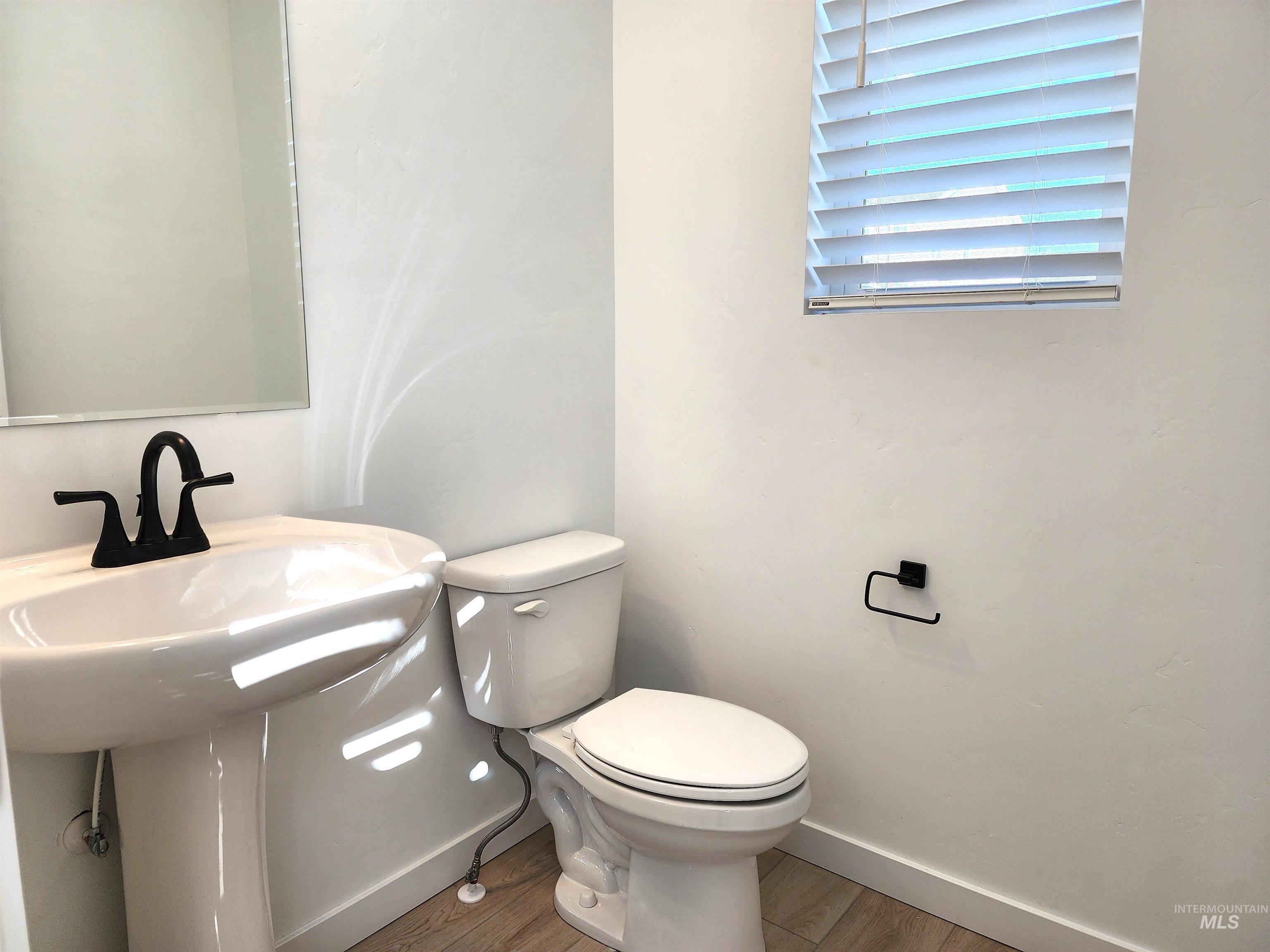 12267 West Endsley Street Star, ID 83669 - Photo 6 of 18 Bathroom featuring wood finished floors and baseboards