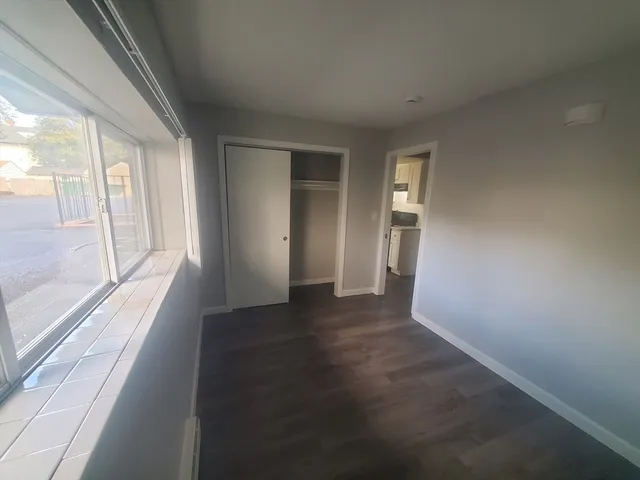 a view of an empty room with a window