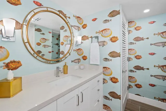 a bathroom with a sink a mirror and shower curtain