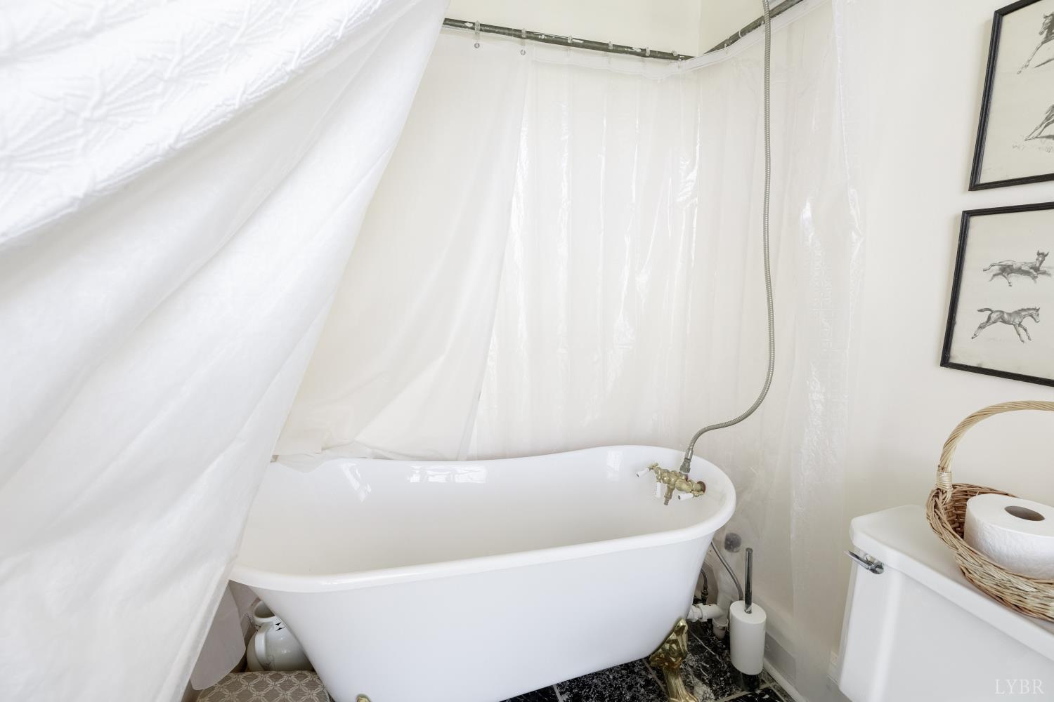 2416 Lowesville Road Amherst, VA 24521 - Photo 43 of 82 a white bath tub sitting next to a white sink