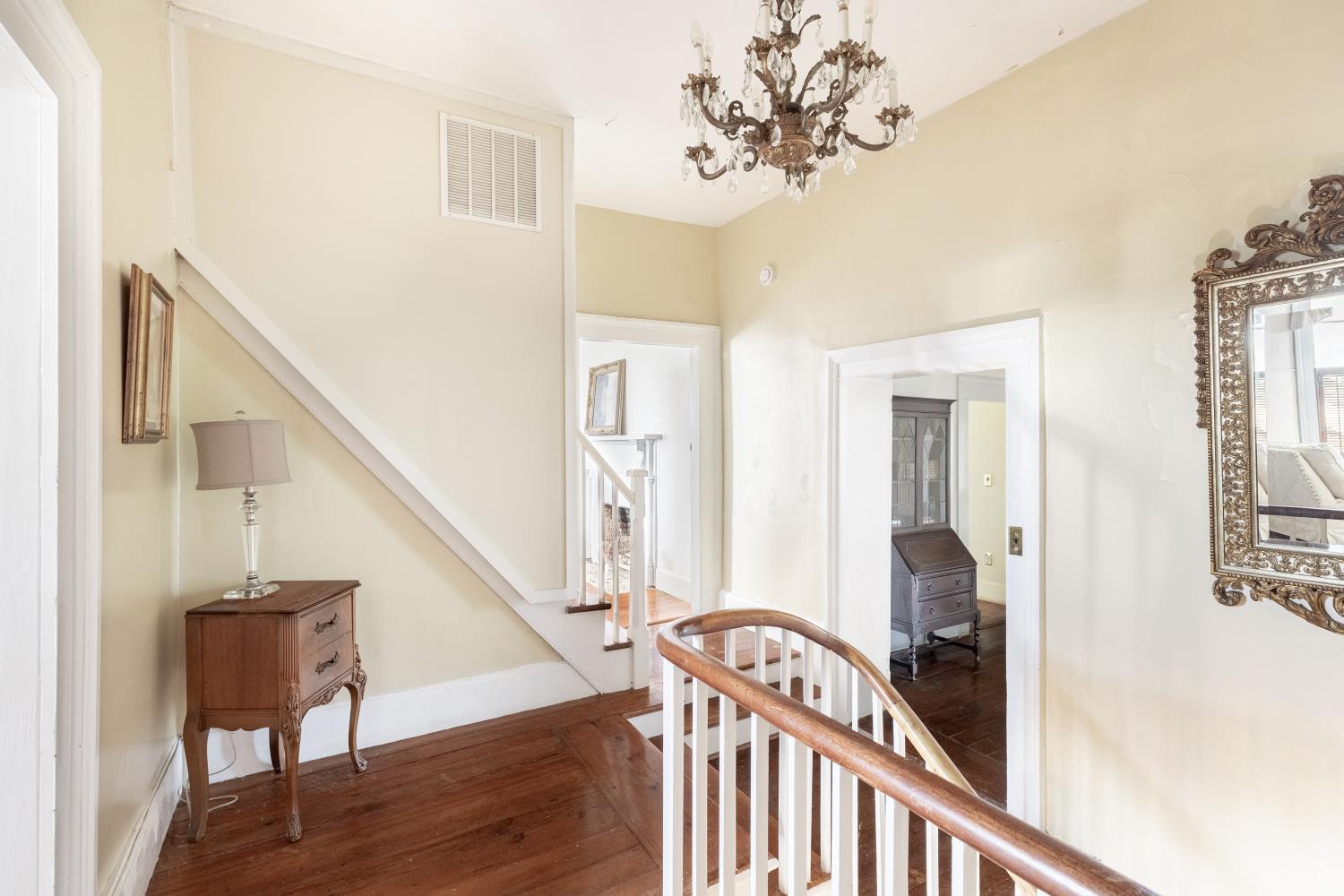 2416 Lowesville Road Amherst, VA 24521 - Photo 44 of 82 a view of a hallway with wooden floor and staircase