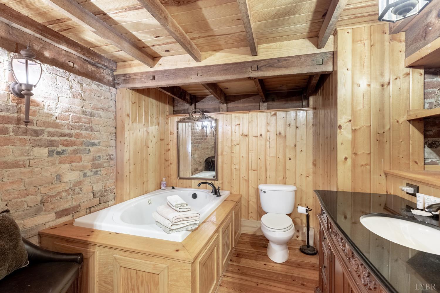2416 Lowesville Road Amherst, VA 24521 - Photo 53 of 82 a bathroom with a sink toilet and shower