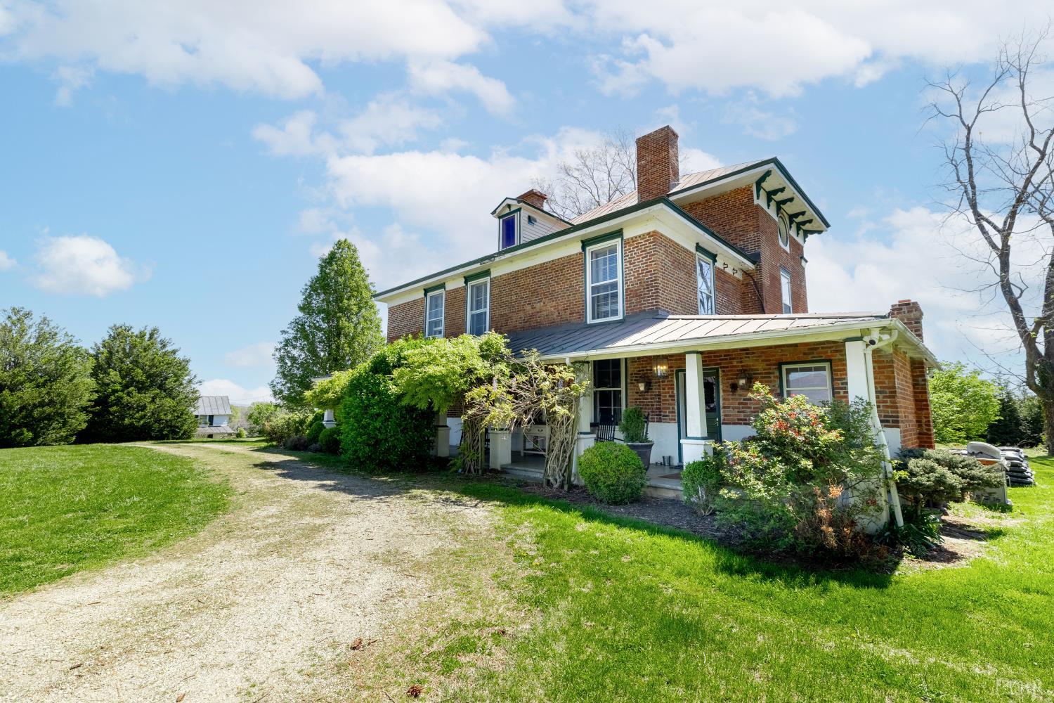 2416 Lowesville Road Amherst, VA 24521 - Photo 60 of 82 a front view of a house with a garden