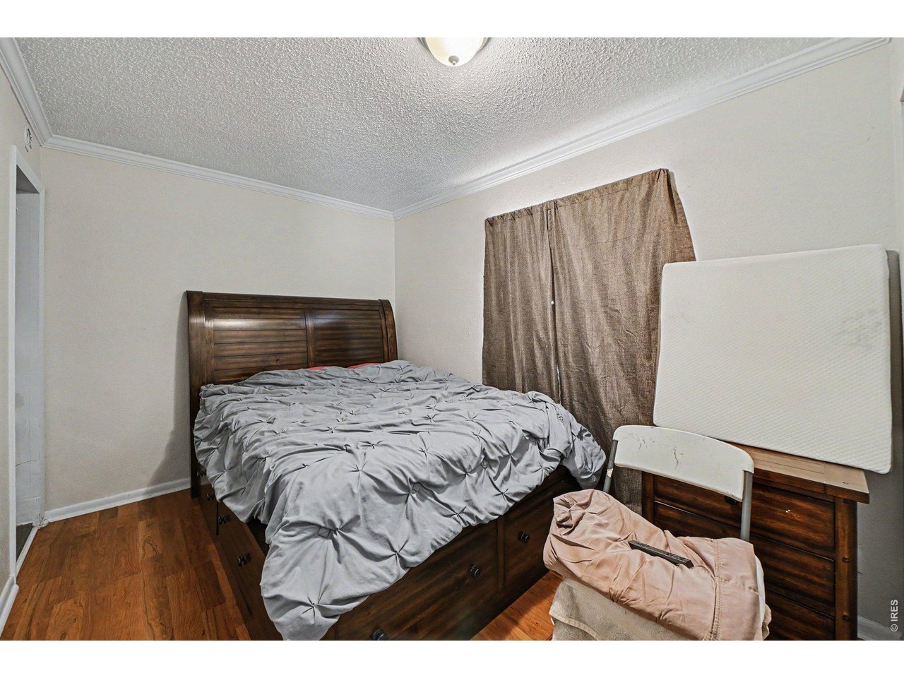 427 9th Street Greeley, CO 80631 - Photo 14 of 22 a bedroom with a bed and a night stand