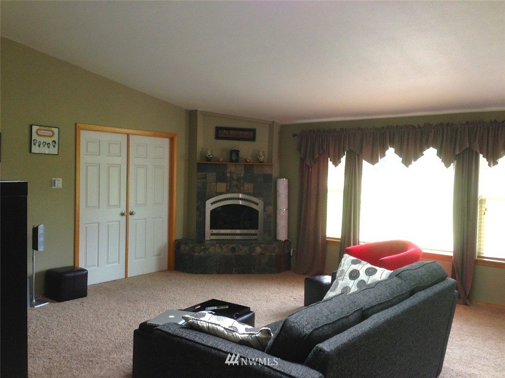 356 Yates Road Chehalis, WA 98532 - Photo 5 of 21 a living room with furniture and a fireplace