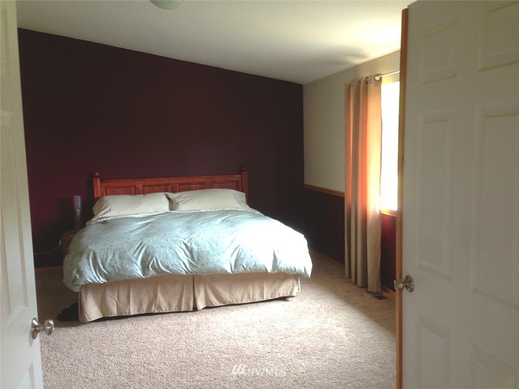 356 Yates Road Chehalis, WA 98532 - Photo 10 of 21 a bed sitting in a bedroom next to a window
