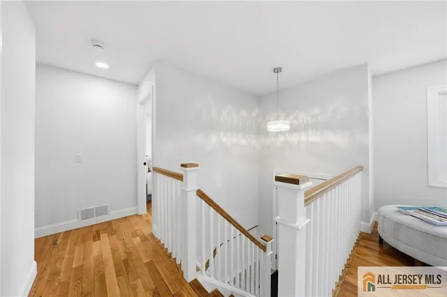 a view of a hallway with staircase