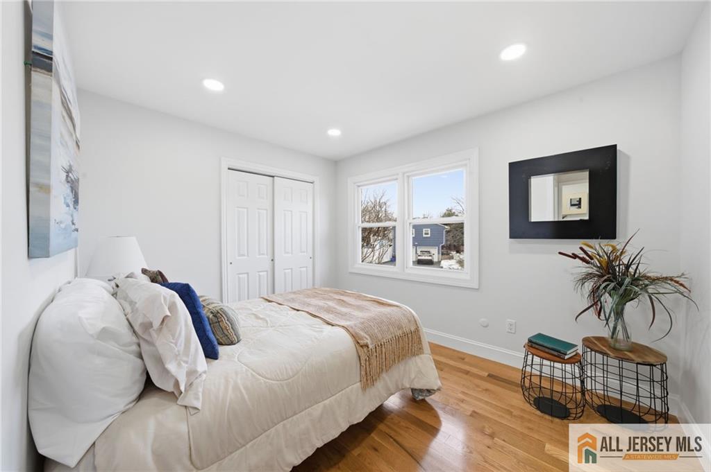 6 Wilton Avenue Middlesex, NJ 08846 - Photo 15 of 50 a bedroom with a bed and a couch