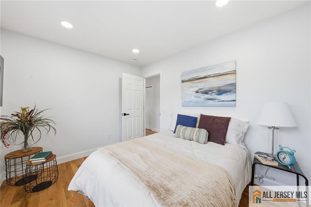 6 Wilton Avenue Middlesex, NJ 08846 - Photo 17 of 50 a bedroom with a bed and a lamp on table