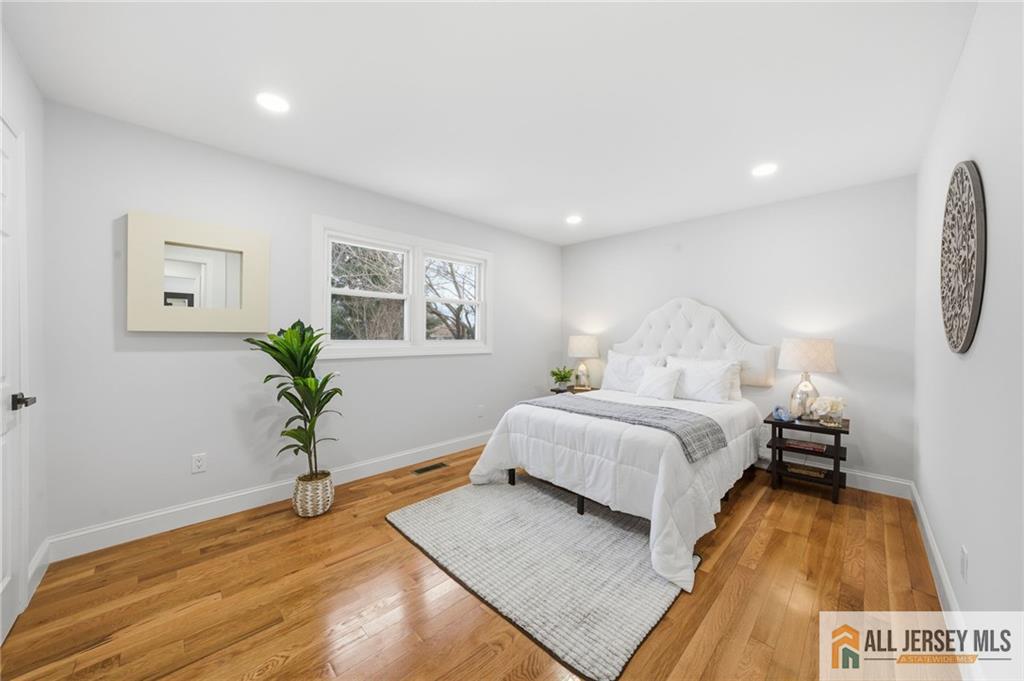 6 Wilton Avenue Middlesex, NJ 08846 - Photo 19 of 50 a bedroom with a bed and a potted plant