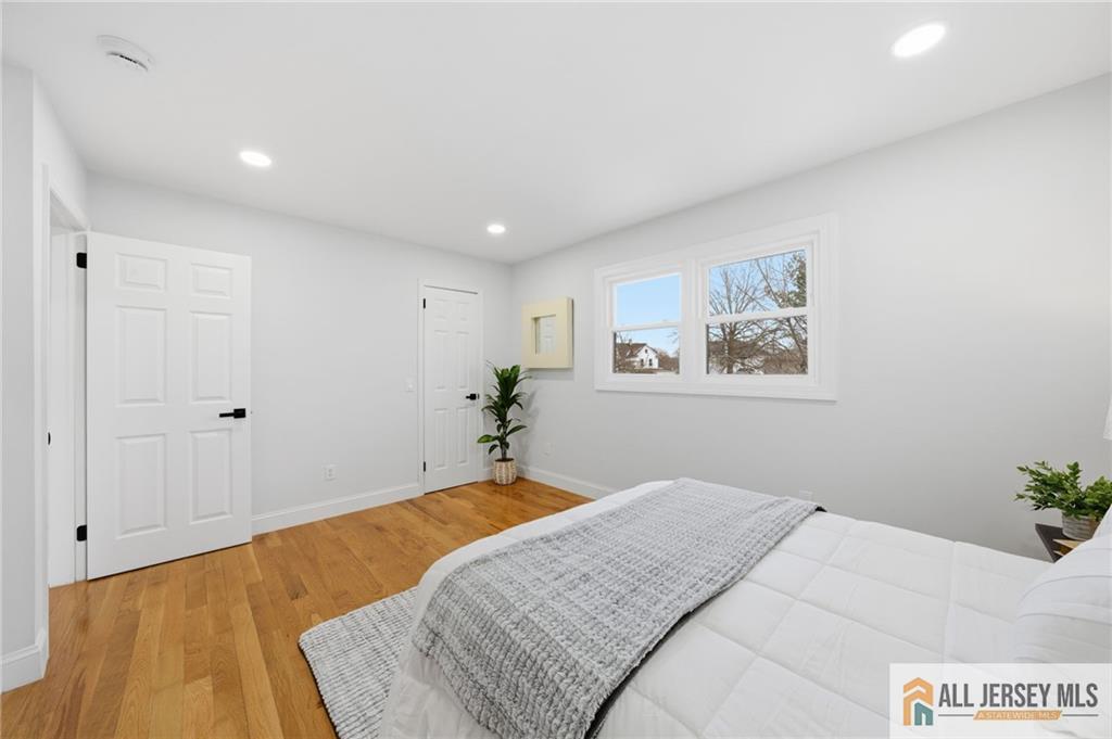 6 Wilton Avenue Middlesex, NJ 08846 - Photo 22 of 50 a bedroom with a bed and a painting on the wall