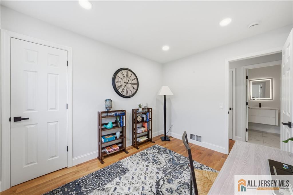 6 Wilton Avenue Middlesex, NJ 08846 - Photo 27 of 50 a view of a bedroom with a bed and wooden floor