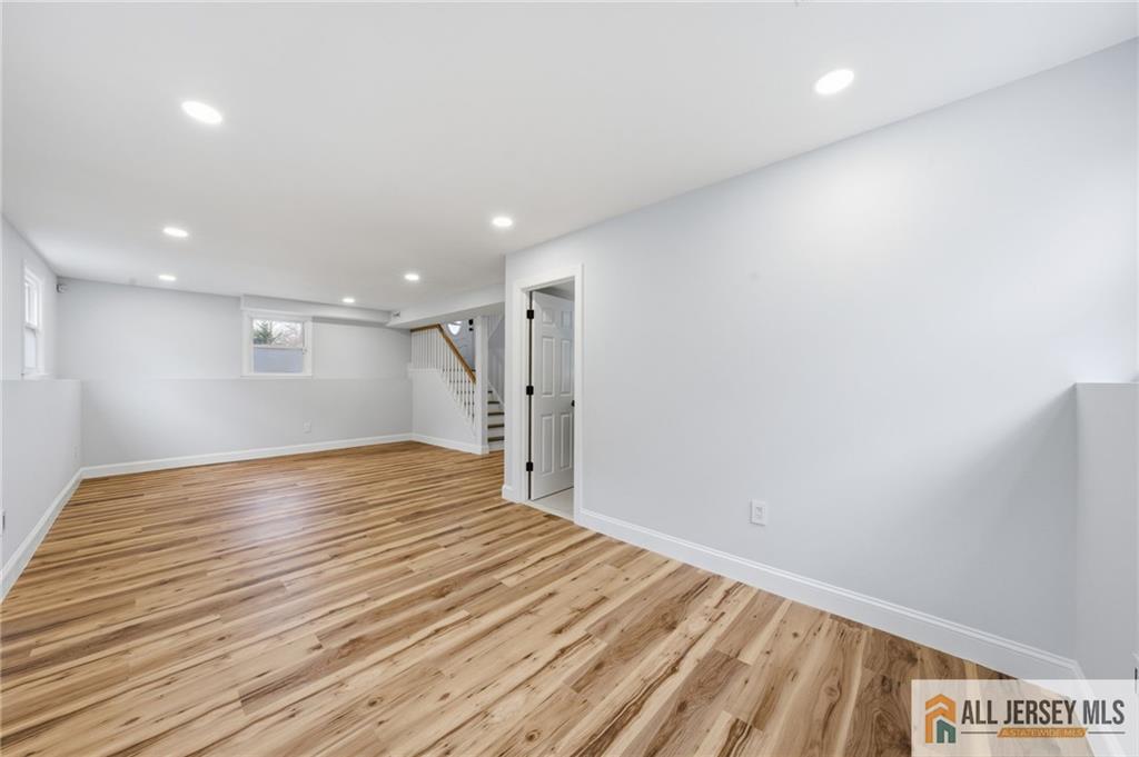 6 Wilton Avenue Middlesex, NJ 08846 - Photo 29 of 50 a view of an empty room with wooden floor