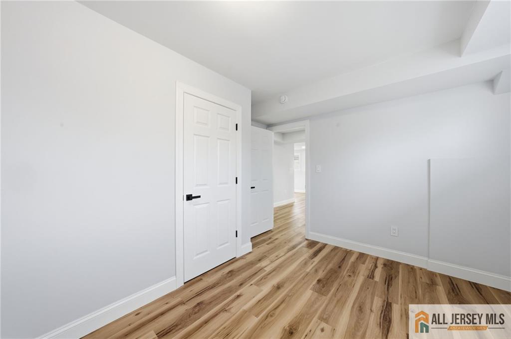 6 Wilton Avenue Middlesex, NJ 08846 - Photo 37 of 50 a view of a room with wooden floor