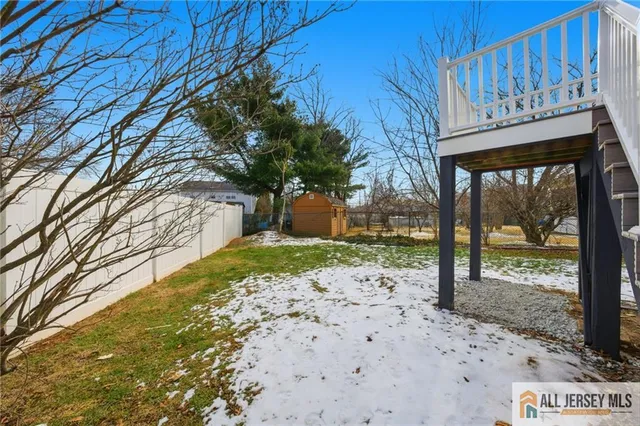 a view of a yard with a tree