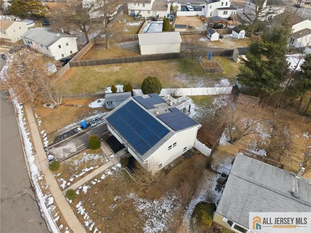 an aerial view of a house with a ocean view