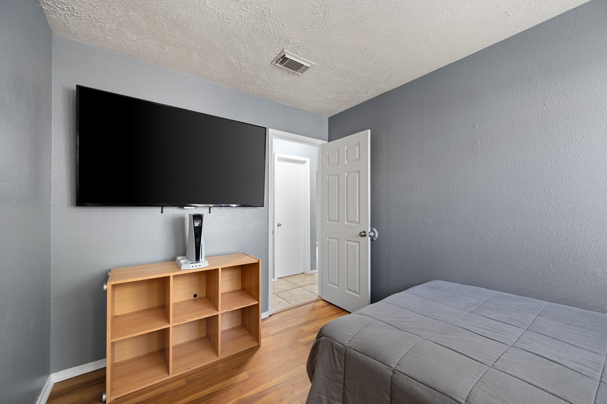 1804 Spruce Drive Rosenberg, TX 77471 - Photo 21 of 29 a bedroom with a bed and a flat screen tv