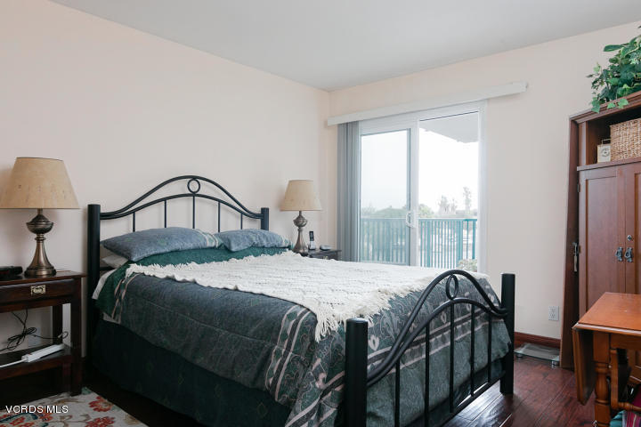 2901 Peninsula Road, Unit 237 Oxnard, CA 93035 - Photo 15 of 35 a bedroom with a bed next to a window with outer view