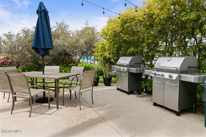 2901 Peninsula Road, Unit 237 Oxnard, CA 93035 - Photo 30 of 35 a patio with a table and chairs