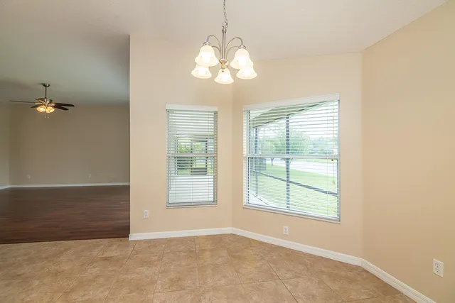 a view of a kitchen with a refrigerator a sink dishwasher a refrigerator and a large window