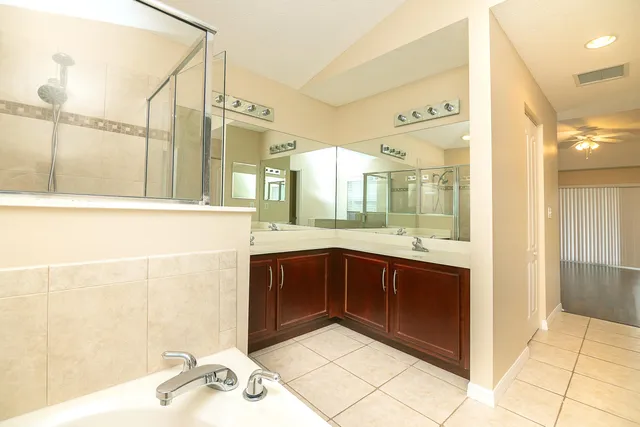 a bathroom with a bathtub and a sink