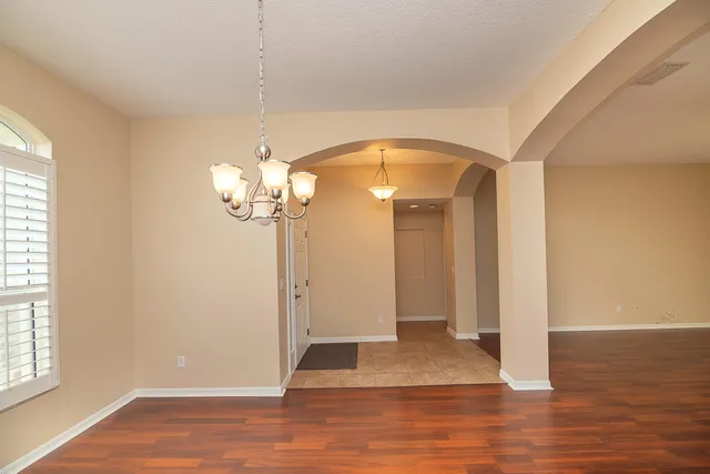a white toilet sitting next to a shower
