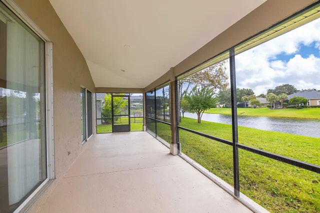 a view of entryway and hall with a chandelier