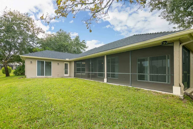 a view of an empty room with glass door