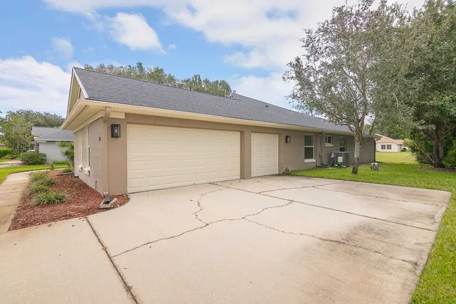 front view of a house with a garden