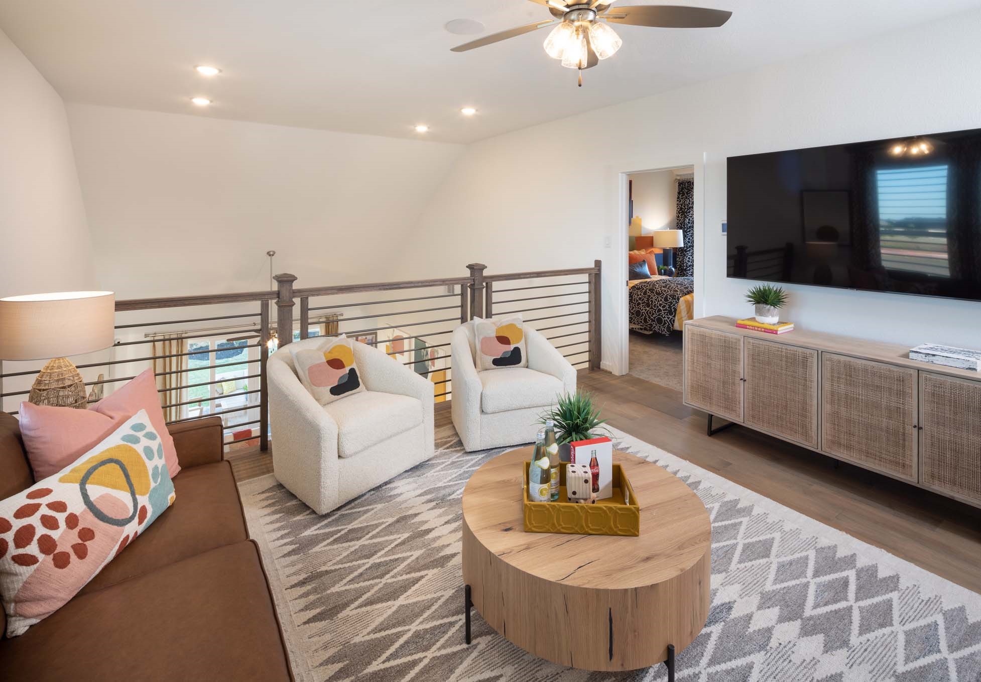 5310 Getty Lane Manvel, TX 77578 - Photo 20 of 37 a living room with furniture and a flat screen tv
