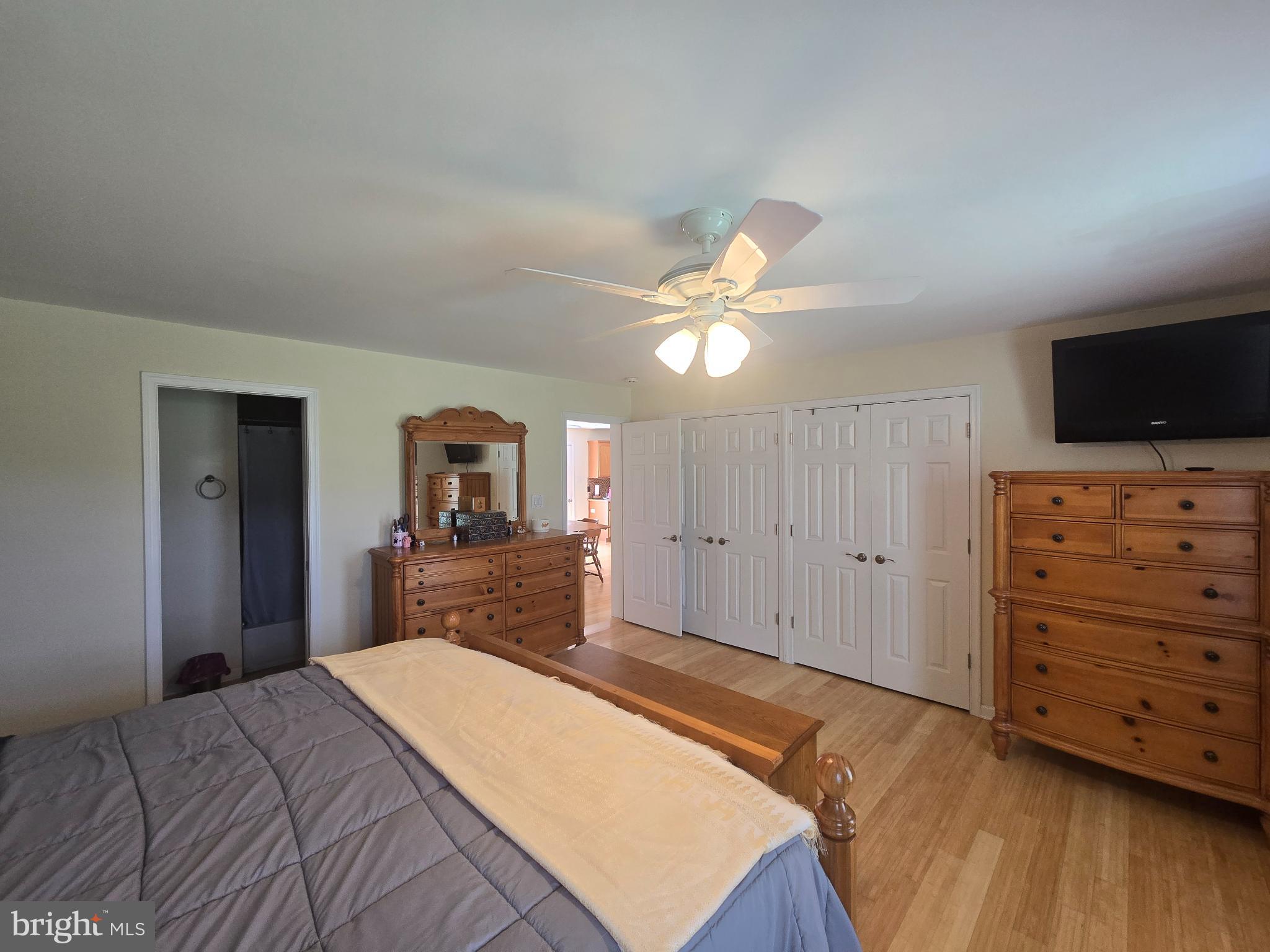 18453 Joseph Road Milton, DE 19968 - Photo 17 of 49 a bedroom with a bed and a flat screen tv