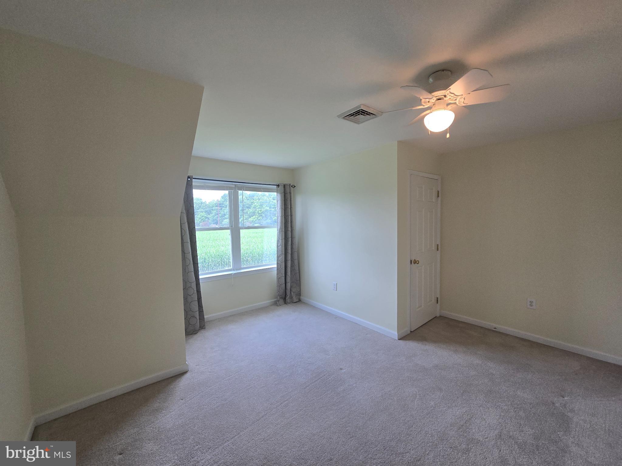 18453 Joseph Road Milton, DE 19968 - Photo 28 of 49 a view of an empty room with a window