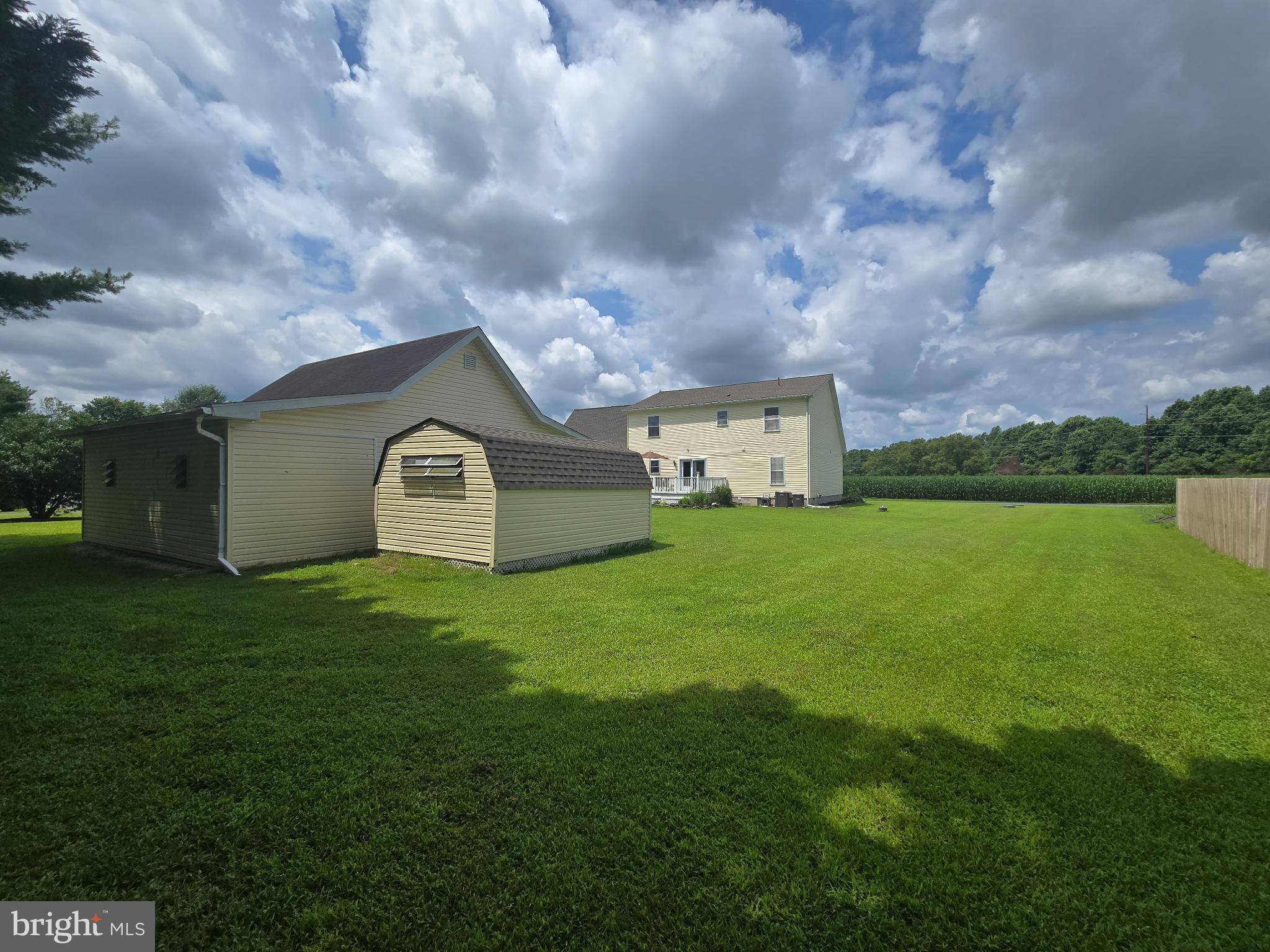 18453 Joseph Road Milton, DE 19968 - Photo 36 of 49 a house view with garden space and wooden fence