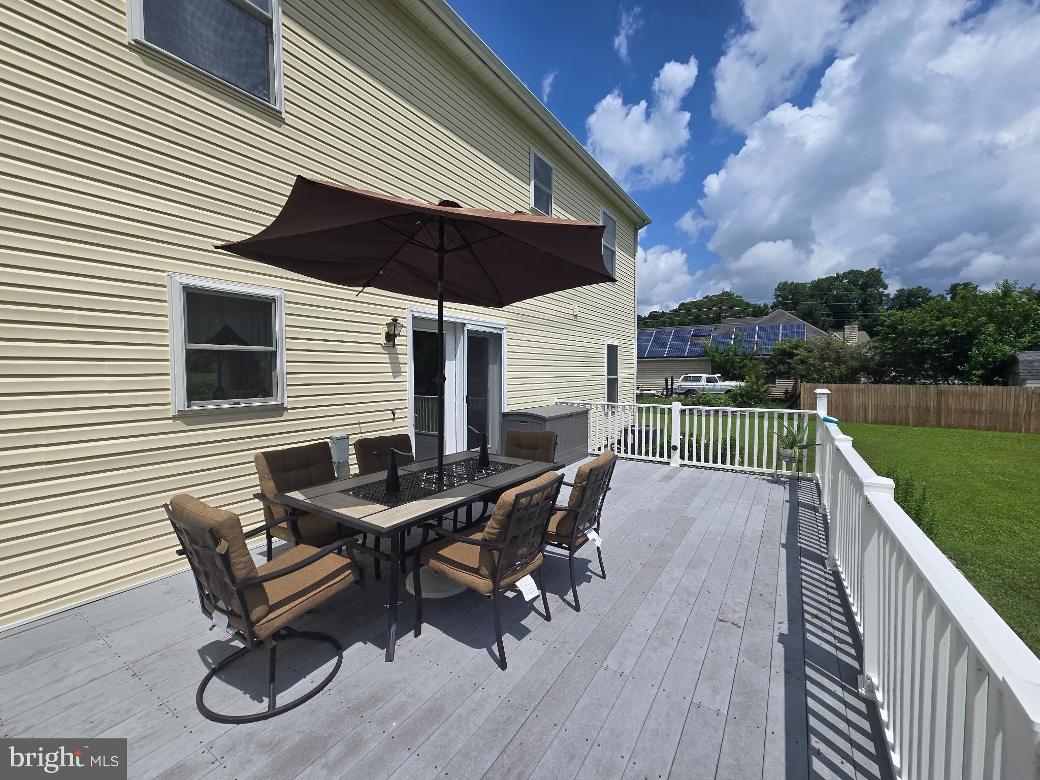 18453 Joseph Road Milton, DE 19968 - Photo 38 of 49 a roof deck with a table and chairs