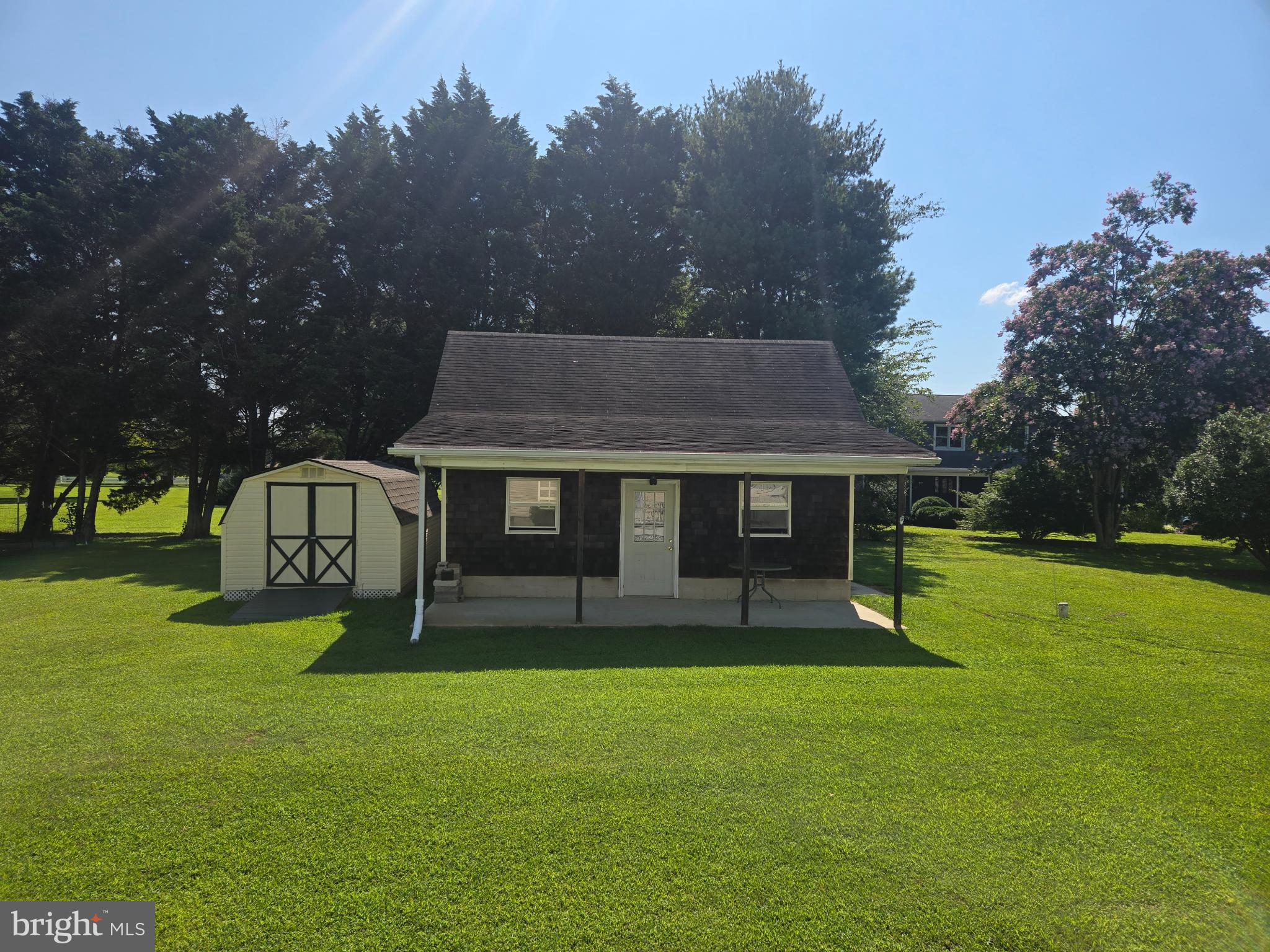 18453 Joseph Road Milton, DE 19968 - Photo 4 of 49 a view of a house with a yard porch and sitting area