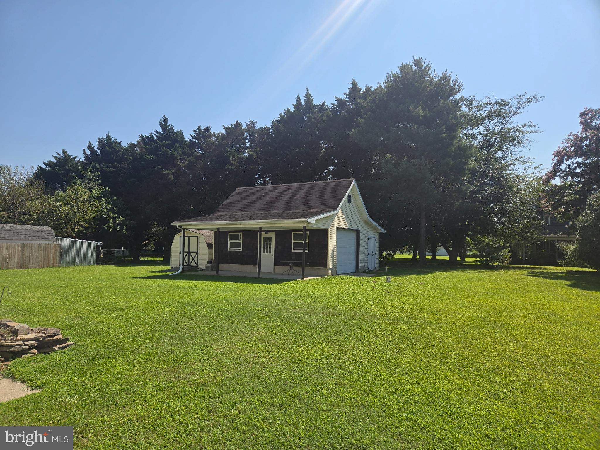 18453 Joseph Road Milton, DE 19968 - Photo 43 of 49 a view of a house with a big yard and large trees