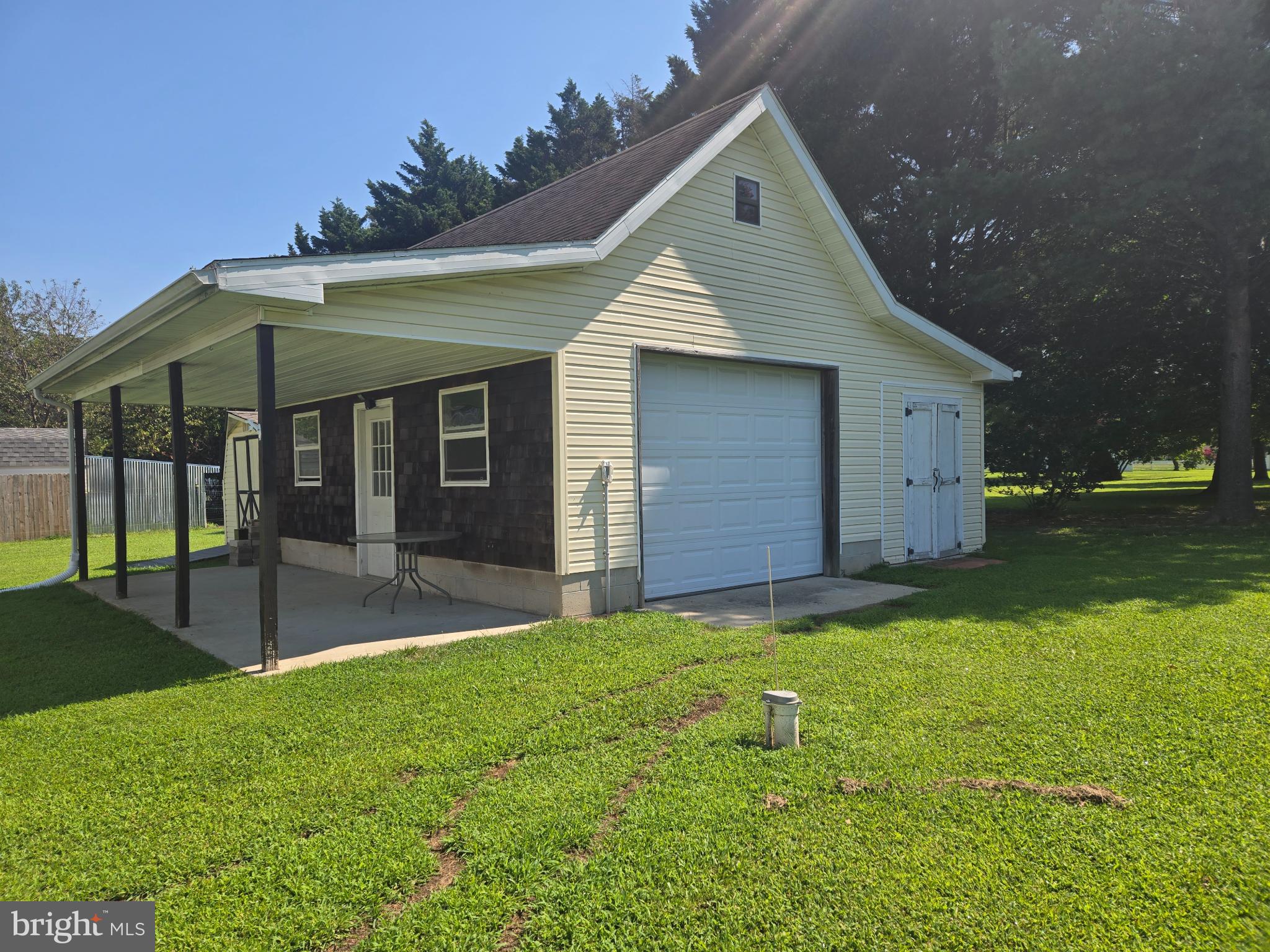 18453 Joseph Road Milton, DE 19968 - Photo 45 of 49 a view of a house with a yard and garage