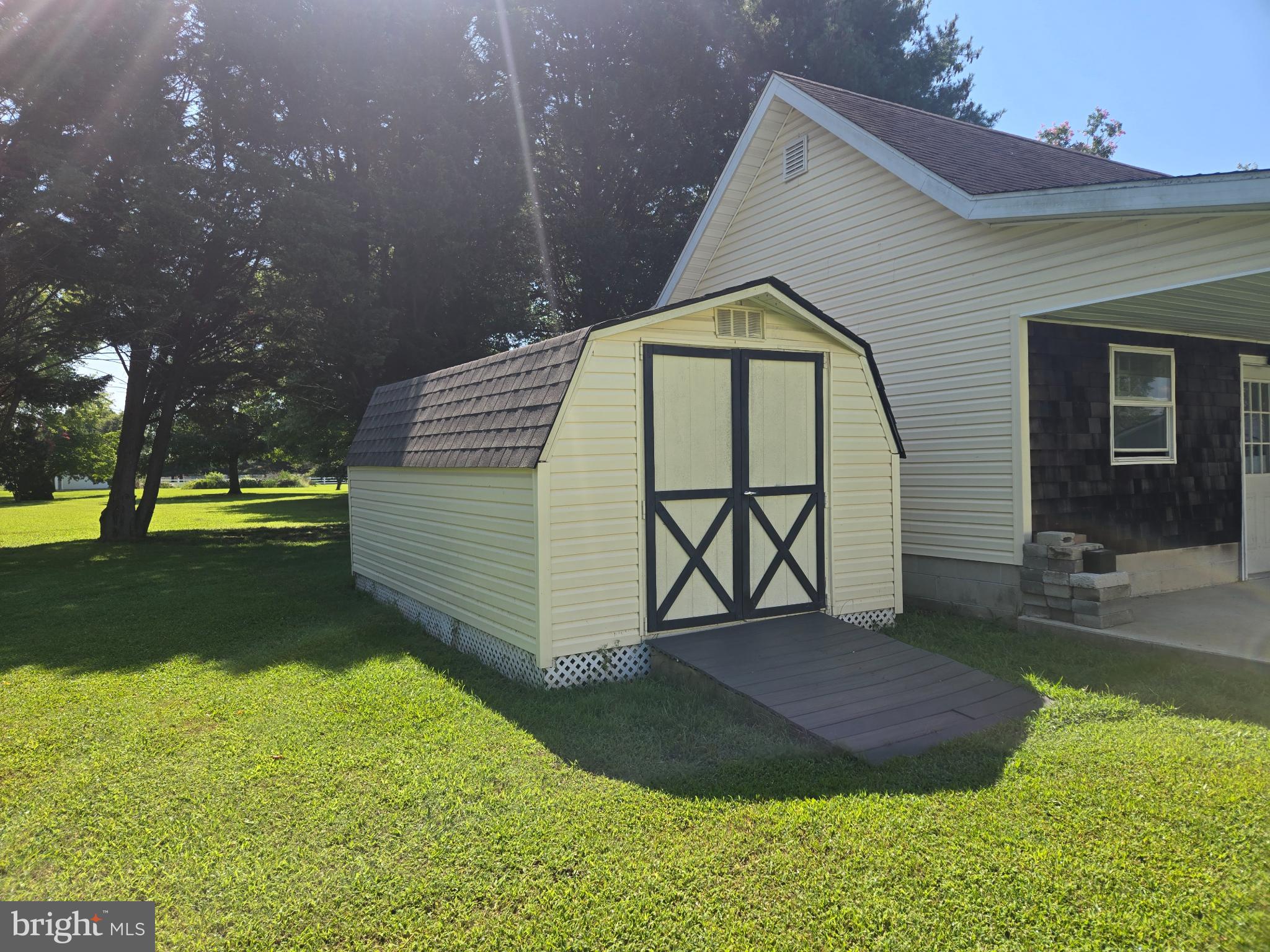 18453 Joseph Road Milton, DE 19968 - Photo 46 of 49 a front view of a house with garden