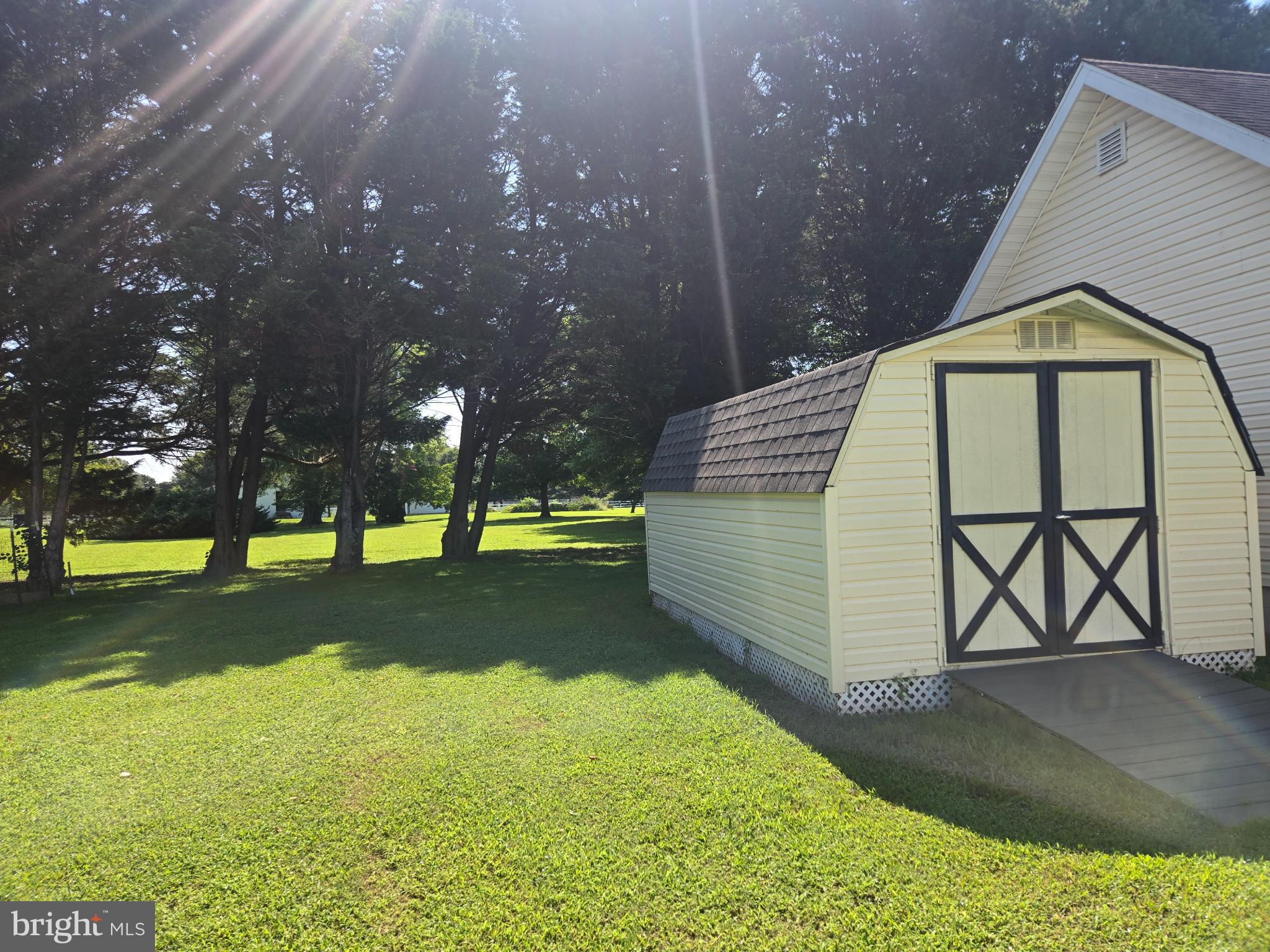 18453 Joseph Road Milton, DE 19968 - Photo 47 of 49 a front view of a house with a yard and trees