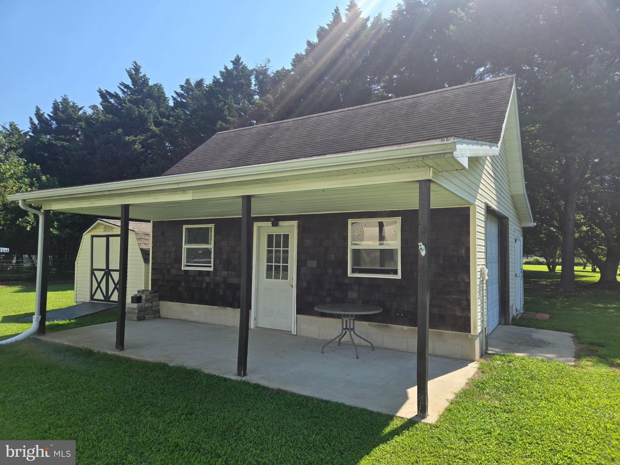 18453 Joseph Road Milton, DE 19968 - Photo 5 of 49 a backyard of a house with table and chairs