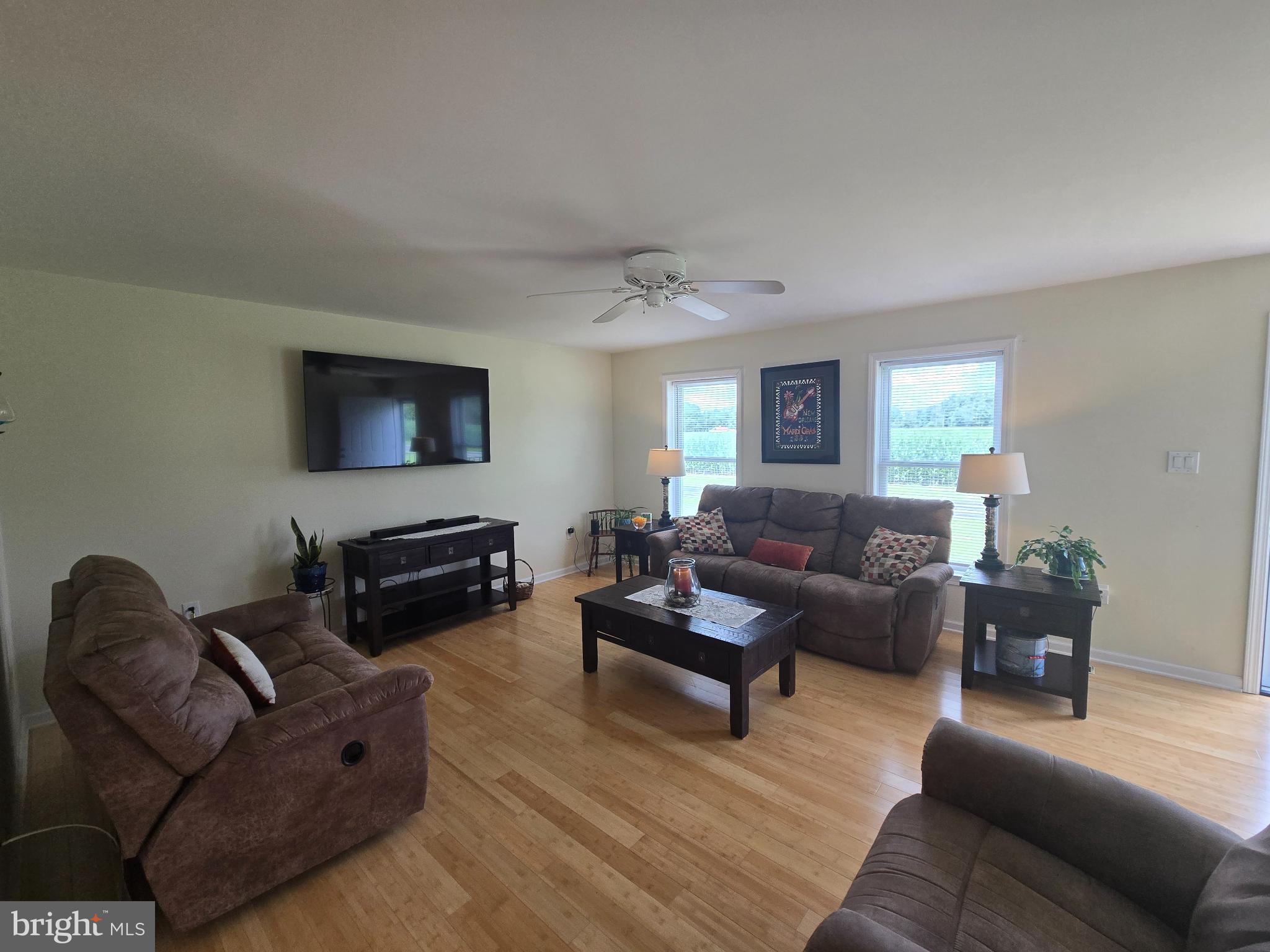 18453 Joseph Road Milton, DE 19968 - Photo 8 of 49 a living room with furniture or couch and a flat screen tv