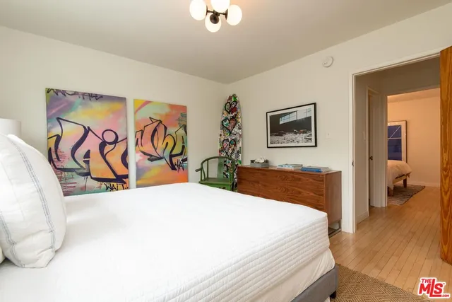 a bedroom with a large bed and a couch