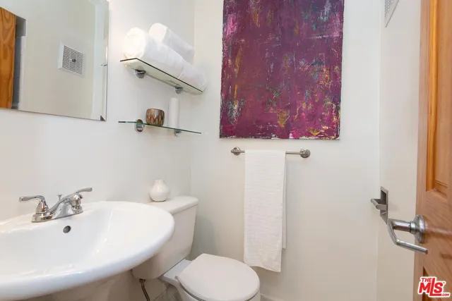 a bathroom with a sink and a toilet